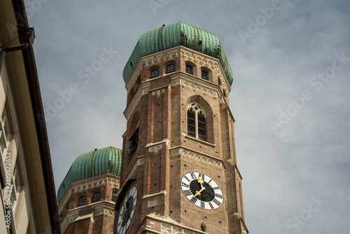 Slika na platnu Frauenkirche cathedral towers, featuring green onion domes and a clock face agai