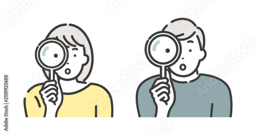 虫眼鏡を使って調べる若い男性と女性