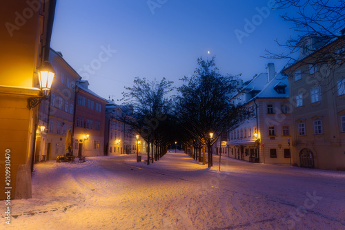 Quadro su tela A quaint street at blue hour in prague during winter