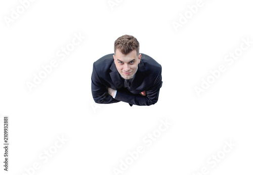 Celebrating success. Low angle view of excited young businessman keeping arms