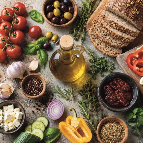 Mediterranean Healthy Food Ingredients with Fresh Vegetables, Olive Oil and Whole Grain Bread