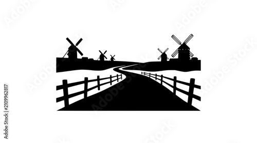Winding Road Leading to Windmills in a Rural Landscape Silhouette