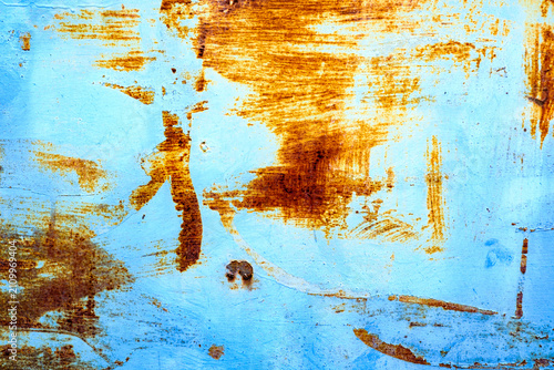 Rusted blue metal background with textured marks