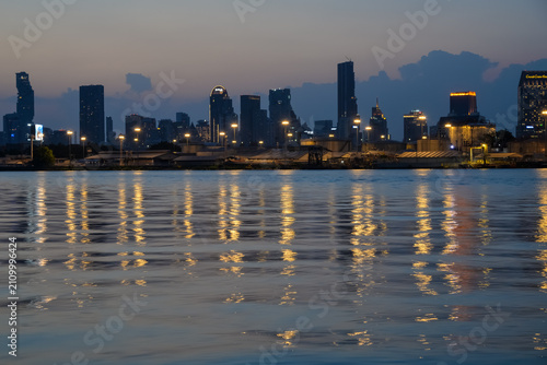 BANGKOK, THAILAND – JUNE 18, 2026: Evening skyline of Bangkok reflected on the Chao Phraya River at blue hour.