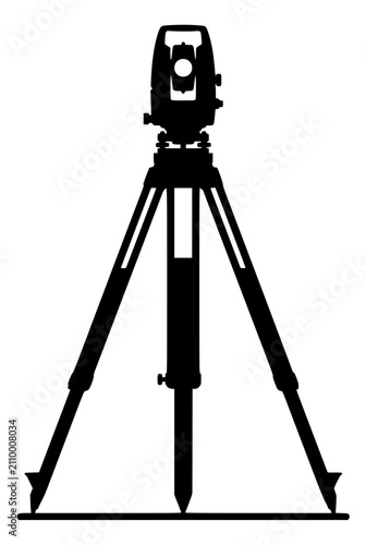 Silhouette of a surveyor total station instrument on a tripod