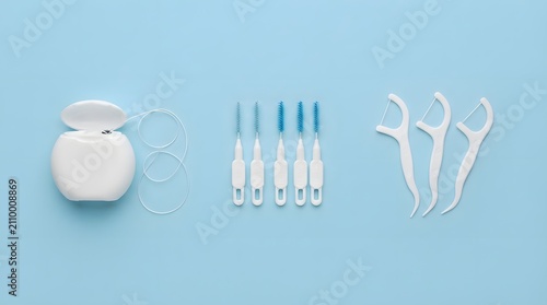 Dental Floss, Interdental Brushes, and Floss Picks on Blue Background