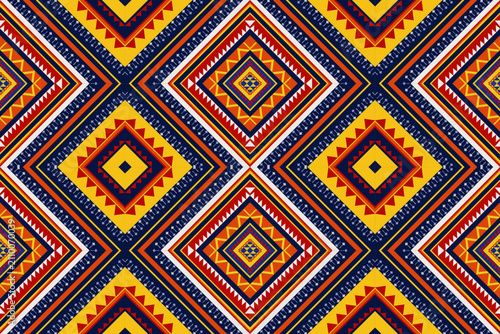 Ethnic tribal seamless geometric pattern with yellow and orange ornament. Traditional Mexican, Native American, or African style vector background for textile and fashion.