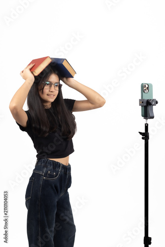 Young female singer singing near microphone stand wearing cap