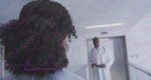 Vertical image: Elevator opening, doctor walking toward nurse, overlay showing data for consult