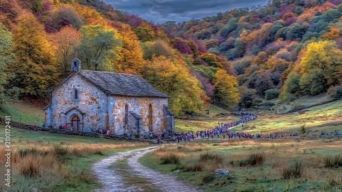 Picturesque autumnal scenery with historic church and procession of people