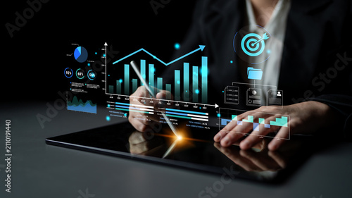 фотографія Business professional analyzing digital data on tablet with financial graphs and charts, focusing on strategy and performance metrics in a modern environment Haptic
