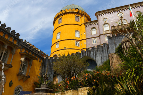Картината върху платно Magnificent close-up of the Pena Palace in Sintra, showcasing its iconic bold yellow cylindrical tower topped with a green dome