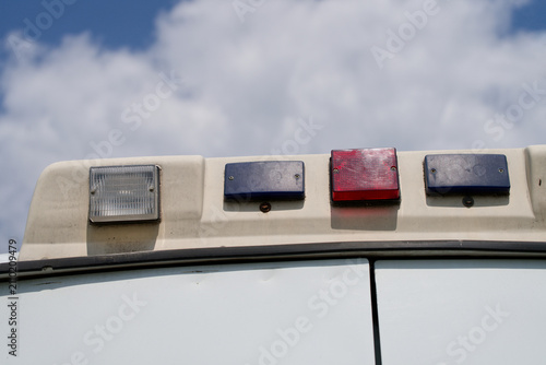 Cuadro en lienzo Rear warning signals mounted on an ambulance vehicle roof under a cloudy sky
