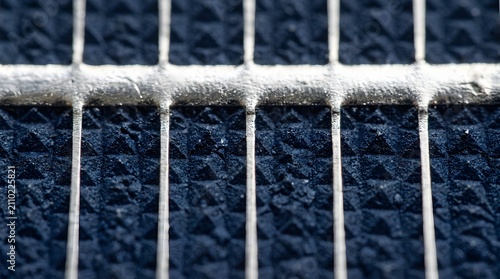Close-up of solar cell silver busbars conducting electricity. High-efficiency photovoltaic panel grid lines for renewable energy technology.