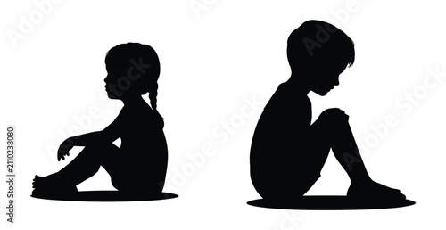 фотографія Sad Silhouettes: The stark black silhouettes of two young children sitting apart convey a profound sense of loneliness and isolation