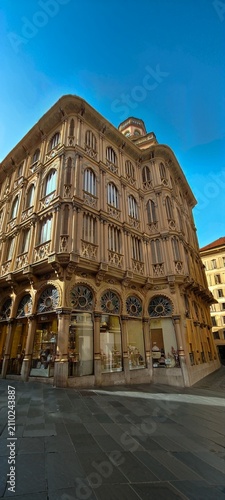 Palma old town building. Historic building with classic architecture with ornate façade and blue sky captured from a dramatic low-angle perspective