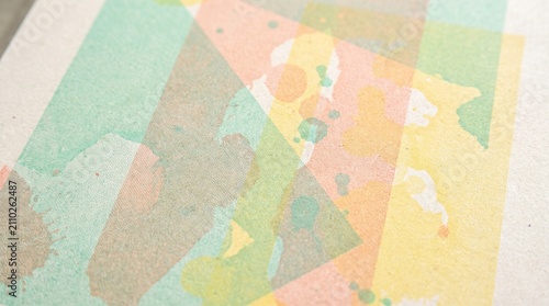 Soft pastel watercolor geometric background with subtle green and orange shapes