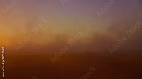 Dramatic misty atmospheric sky background at sunset with copy space