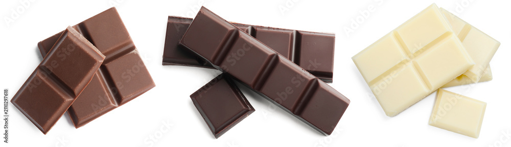 Fototapeta premium Pieces of different types of tasty chocolate isolated on white, set. Top view