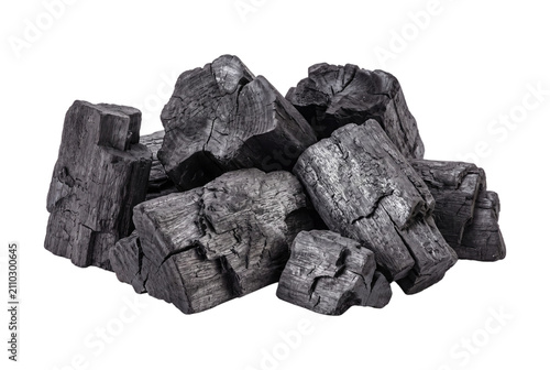 Fotografie Charcoal briquettes pile dark gray isolated on transparent background