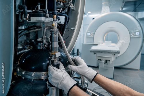 Engineer in white gloves servicing helium cold head and compressor of MRI scanner. Cryogenic system maintenance of magnetic resonance imaging equipment. Generative AI.