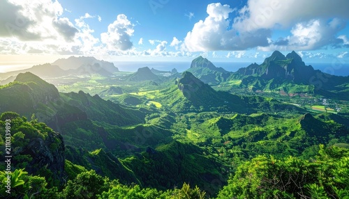 Lush green volcanic mountains rise majestically towards a partly cloudy blue sky over the ocean.