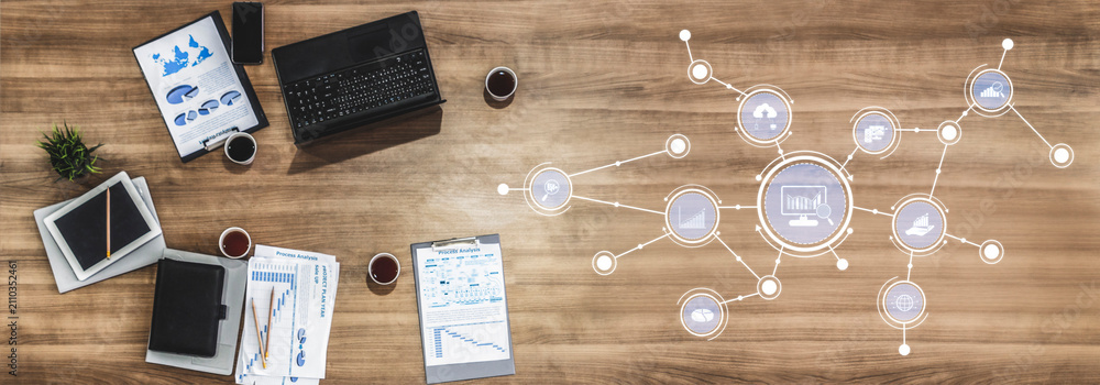 Obraz premium A modern office workspace featuring a laptop, documents, and creative visualizations focused on data analysis, workflow management, and productivity techniques. Tessel