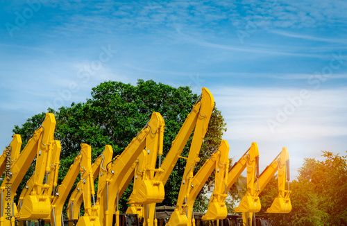 Konstfotografi Hydraulic excavators lined up in equipment yard for construction projects, heavy machinery fleet management, infrastructure development, civil engineering and industrial equipment rental business