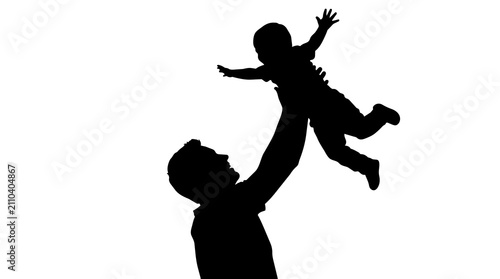 фотографія Silhouette of a happy father lifting his little baby high up in the air showing