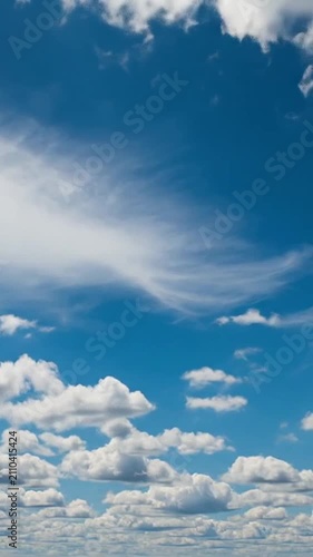 Bright blue sky filled with fluffy white cumulus clouds during daytime