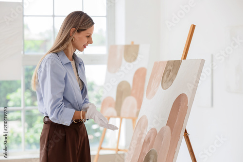 Female artist wearing white...