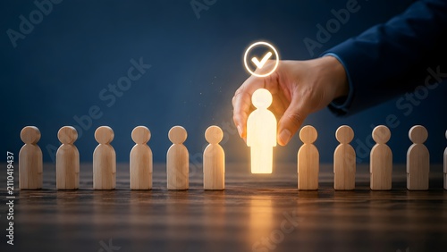 Hand picking glowing figure with checkmark for recruitment