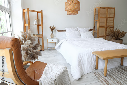 Bright bedroom interior wit...