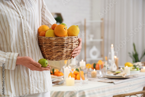 Young woman with basket of ...
