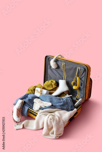 Suitcase with warm clothes,...