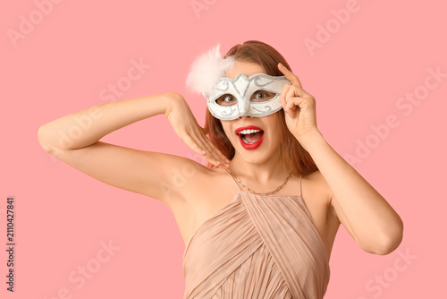 Shocked young woman in whit...