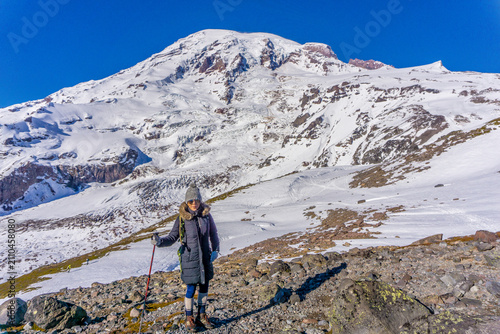 Принти на полотні Snow-capped peak looms above hiker's determined stride