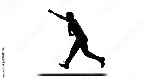 Silhouette of a man jumping and pointing. Active person leaping in the air.