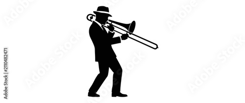 Foto Silhouette of a man playing the trombone