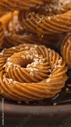 Delicious golden pastries dripping with sweet honey and sesame seeds