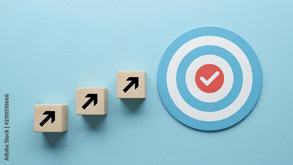 Obraz premium Three wooden blocks with upward arrows on a blue background leading to a target with a red checkmark, symbolizing progress and goal achievement