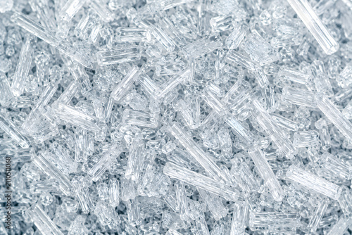 Macro of citric acid crystals, transparent food additive texture background
