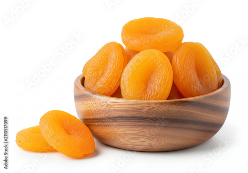A dried apricot halves in a wooden bowl, isolated on a pure white background