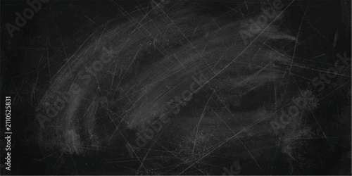 Obraz na płótnie A blackboard surface with chalk dust and scratch marks, suggesting a space for learning or creative thought, ready to be written upon