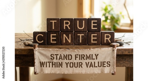 Wooden Blocks Displaying 'True Center' and Banner with Motivational Quote 'Stand Firmly Within Your Values'