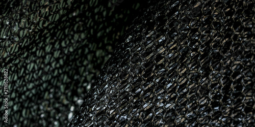 Konstfotografi a close-up texture resembling a dark, densely woven canvas or a coarse textile material