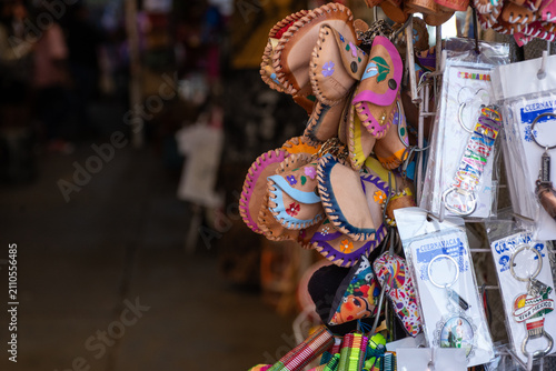 Colorful Leather Pouches And Souvenir Keychains Displayed At Mexican Market Stall