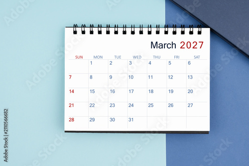 March 2027 monthly desk calendar for 2025 year on blue background.