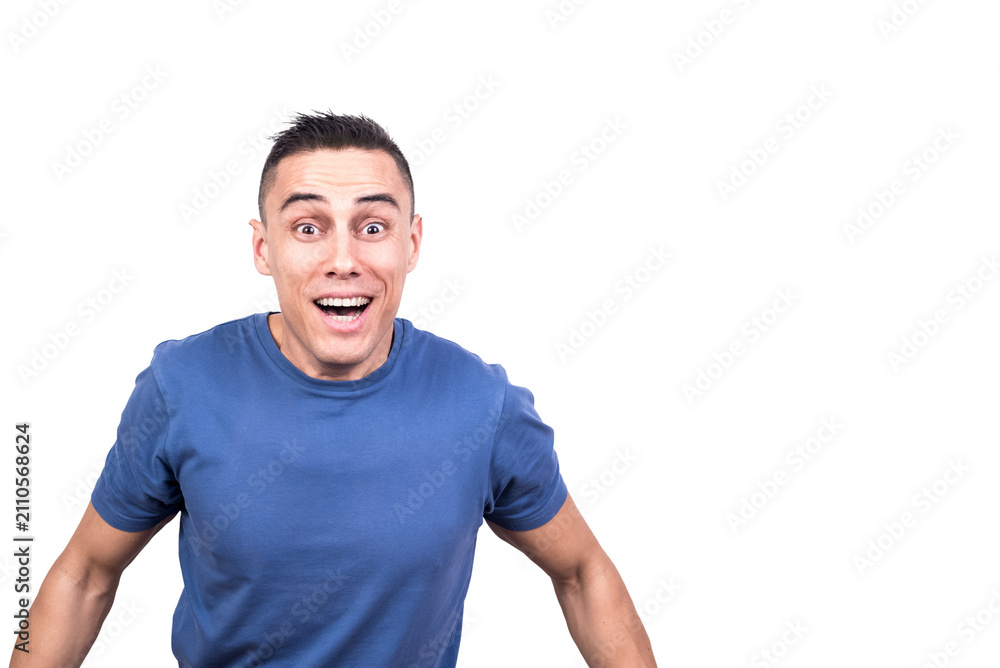 Obraz premium Happy man standing with open eyes while smiling