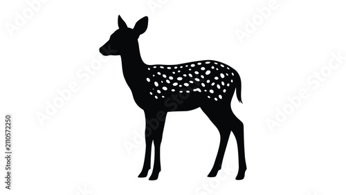 Fotografía Fawn silhouette stands calmly in a profile view showing its spotted fur pattern
